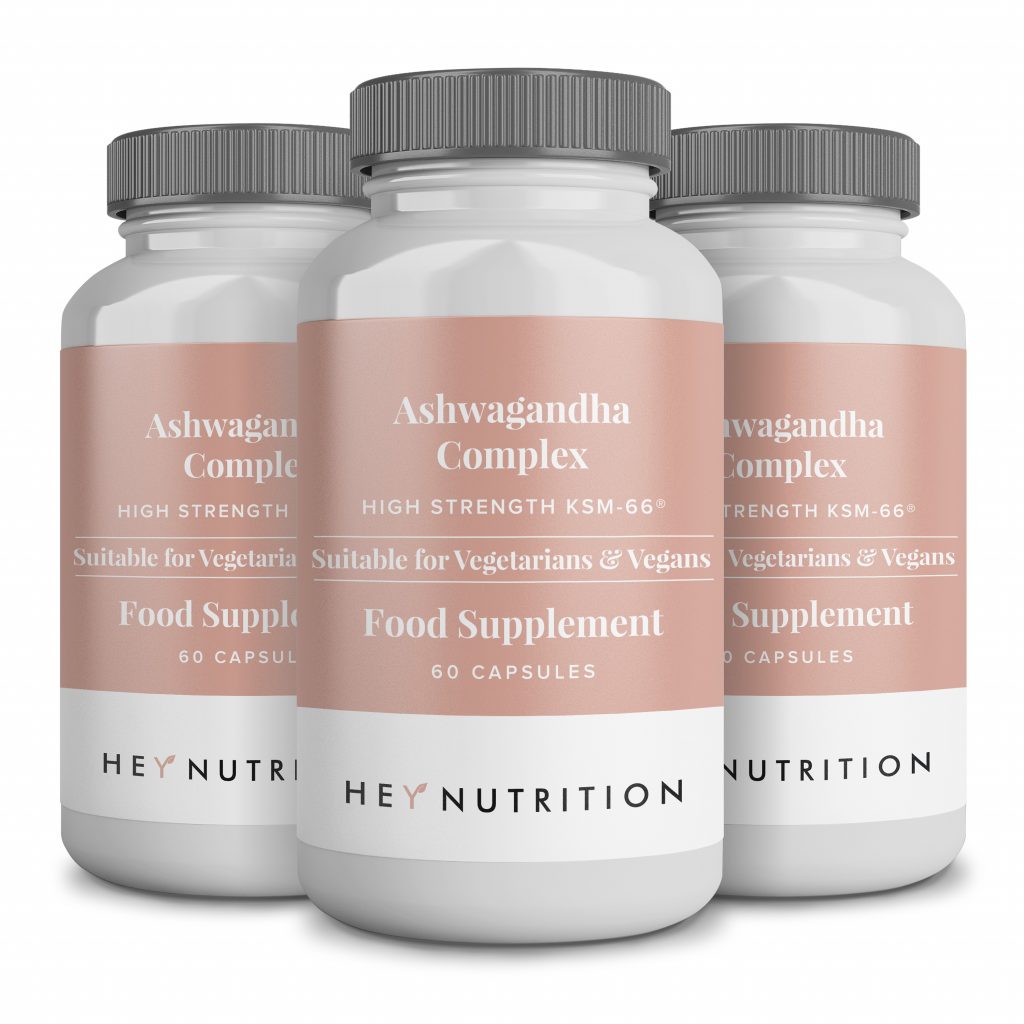 Three Hey Nutrition Ashwagandha Complex supplement bottles with pink labels.