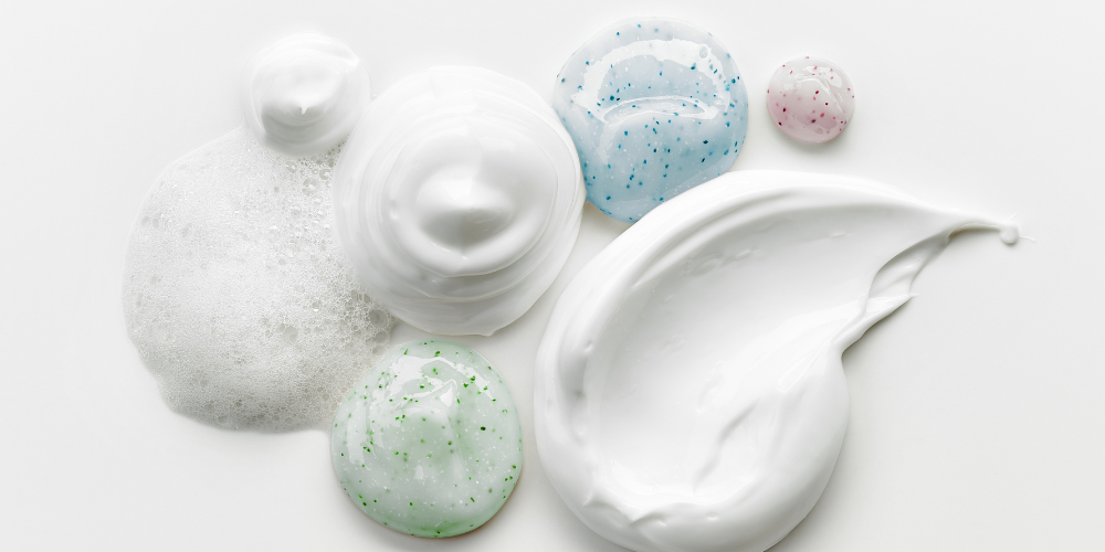 Different skincare product textures on a white background.